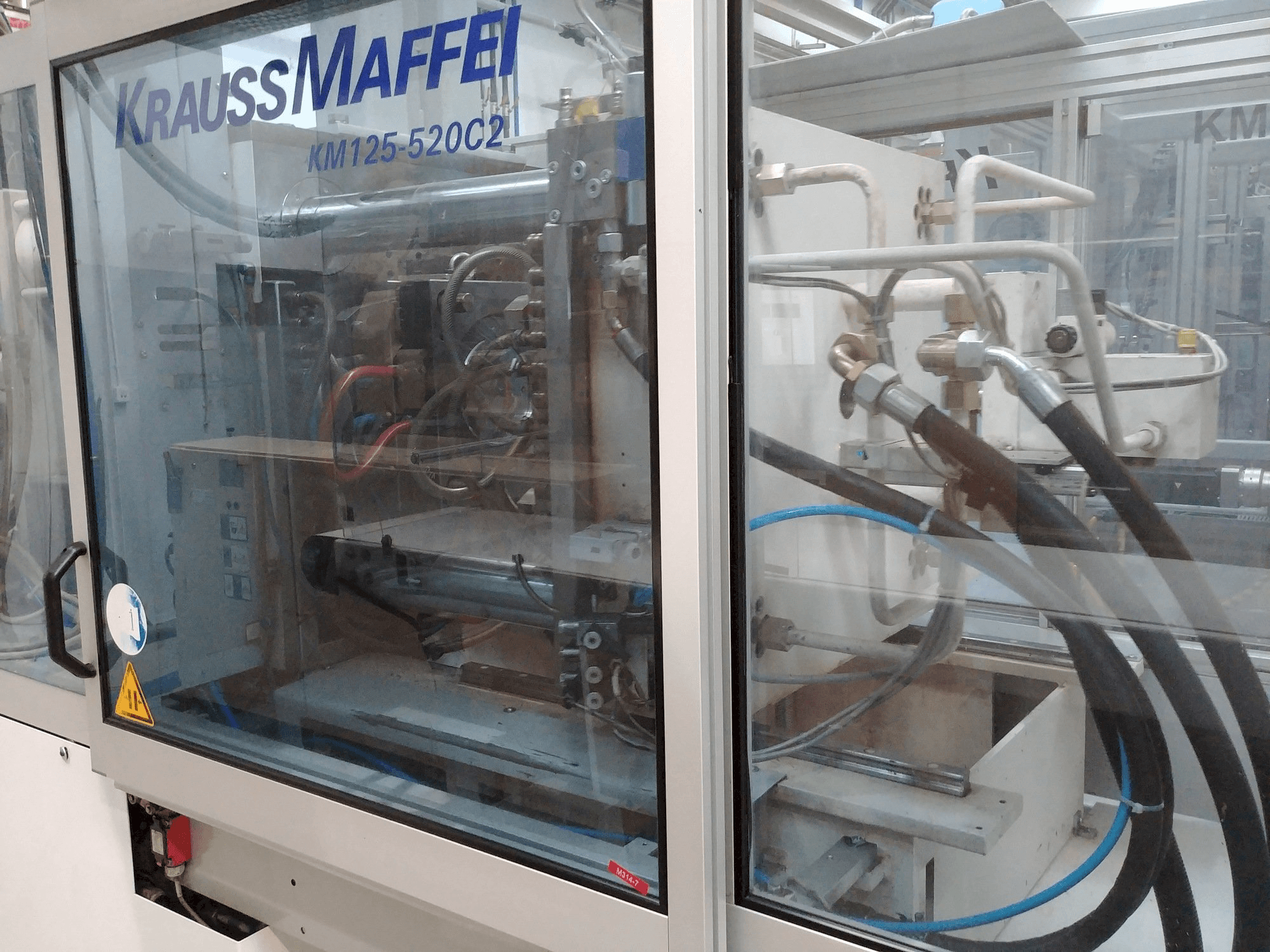 Makine Krauss Maffei KM 125-520 C2 - Sol görünüm
