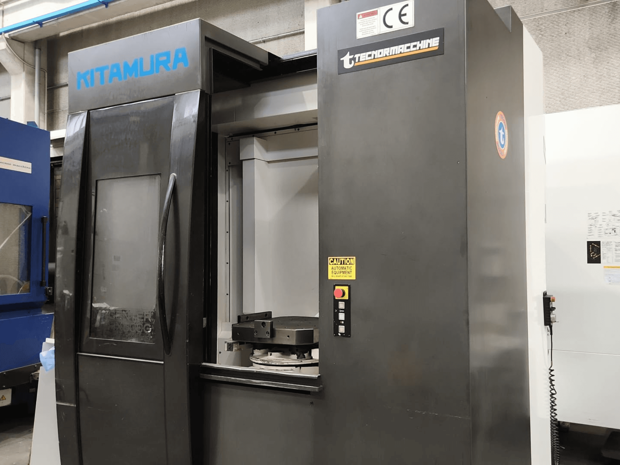 Kitamura Mycenter HX500iG yatay işleme merkezi; kontrol paneli ve çalışma alanını gösteren önden görünüm.