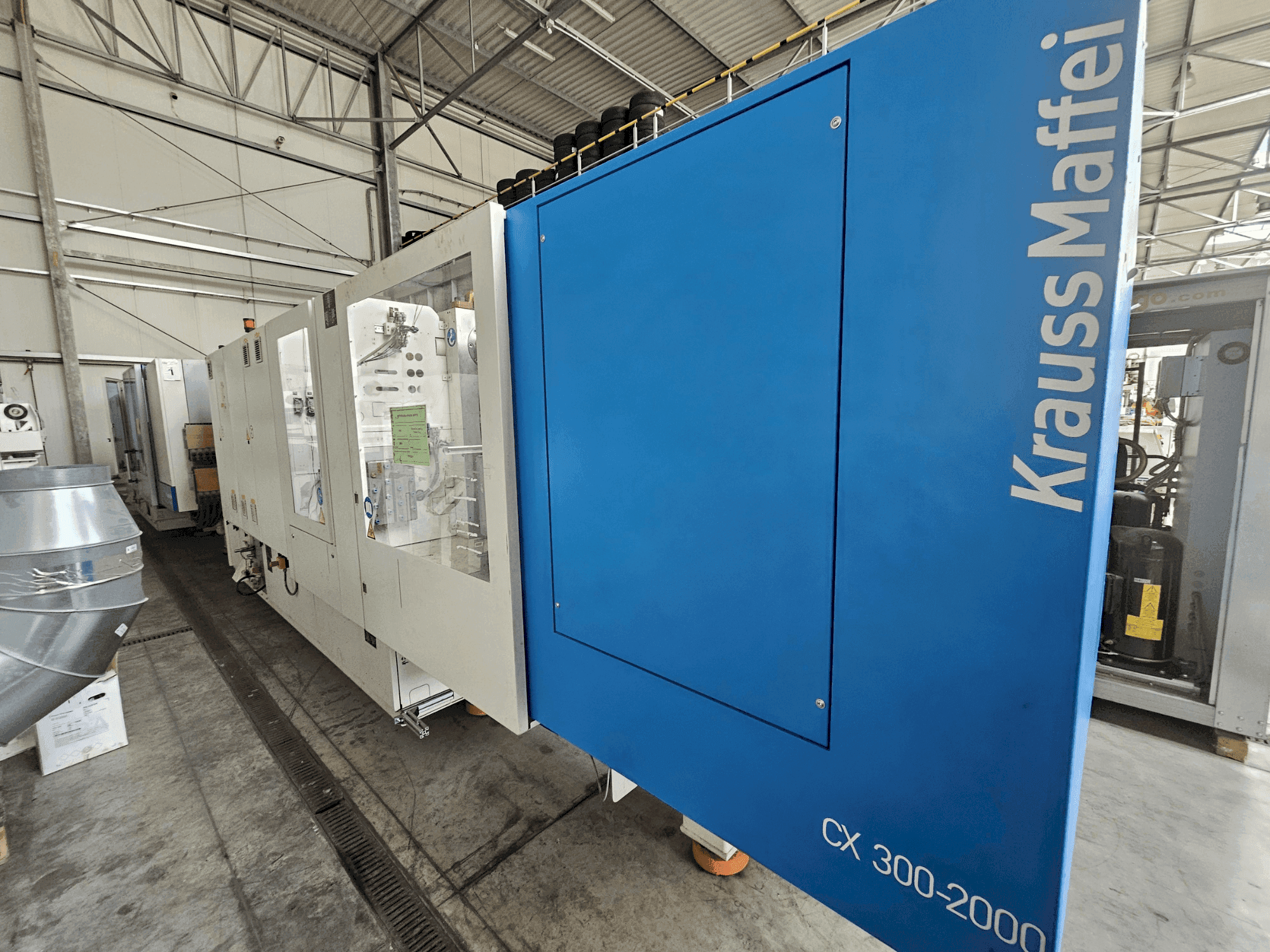 Makine Krauss Maffei 300-2000 CX - Önden görünüm