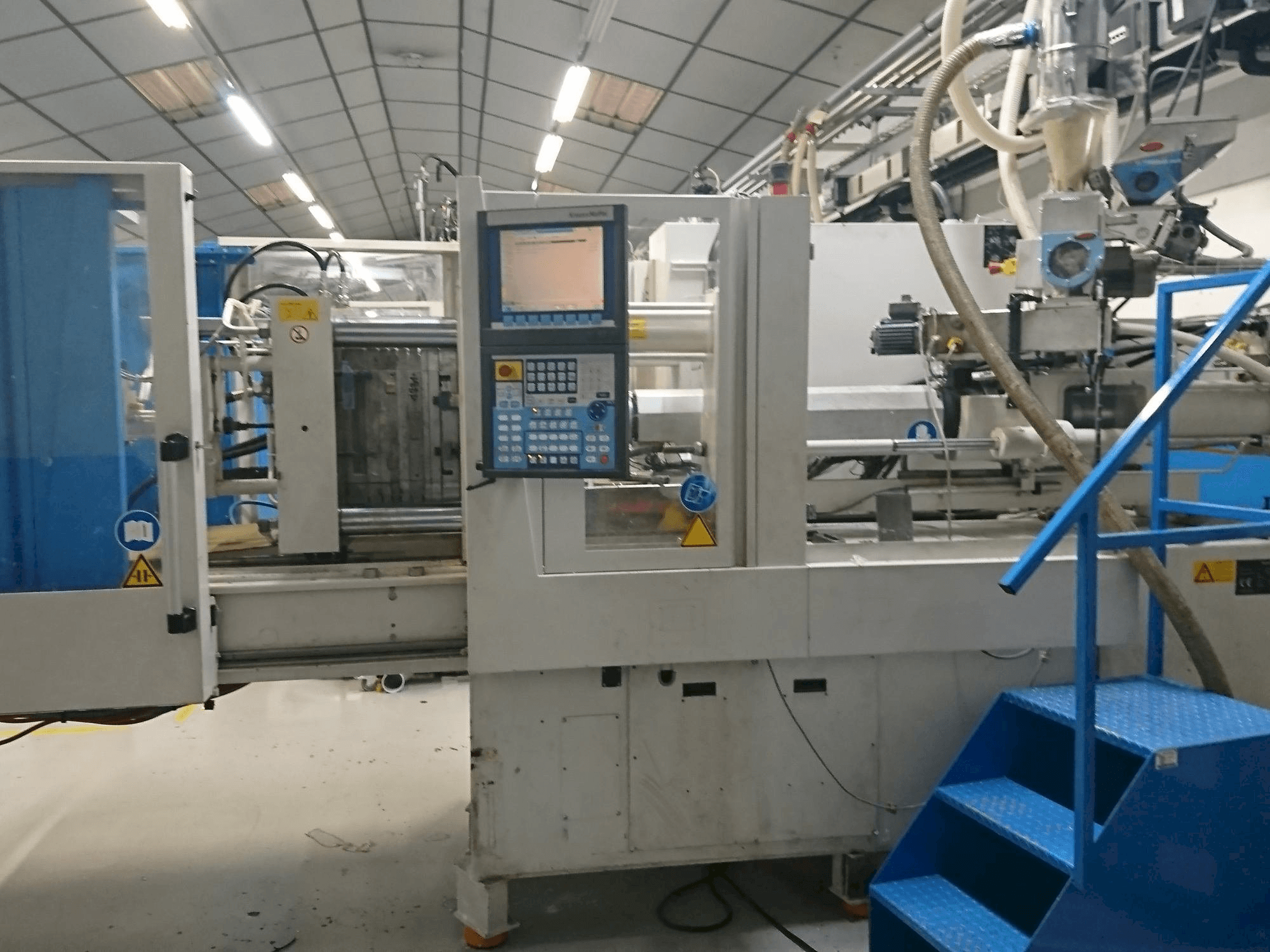 Makine Krauss Maffei 80-750 CX - Önden görünüm