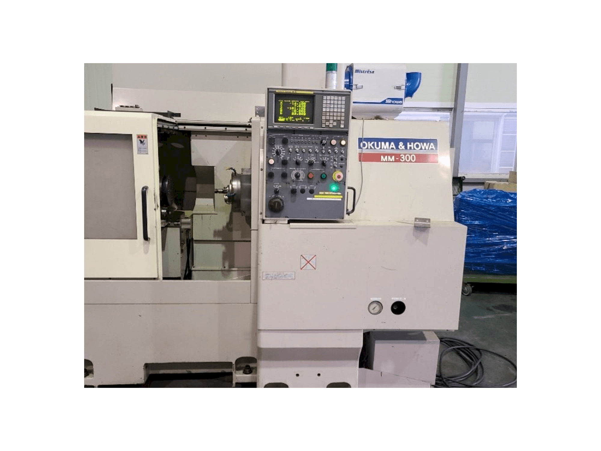 Makine OKUMA&HOWA MM-300 - Önden görünüm