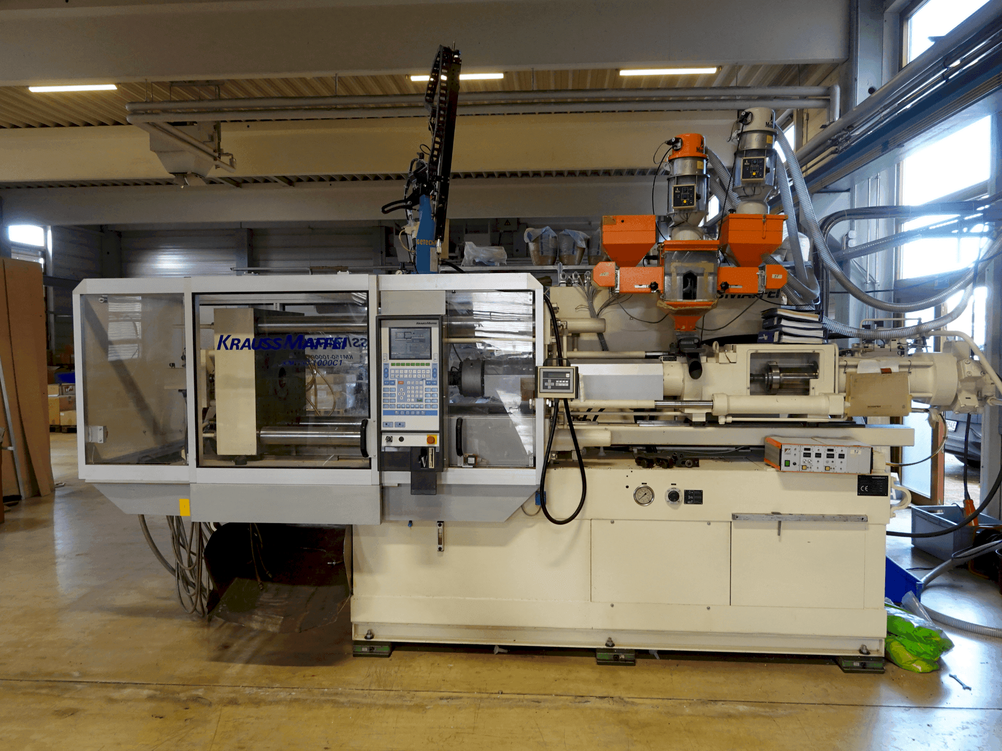 Makine Krauss Maffei KM 150-1000 C1 - Önden görünüm