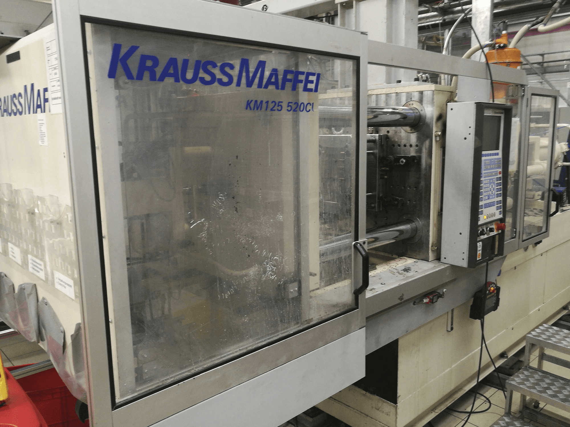 Makine Krauss Maffei - Önden görünüm KM 125-520 C1