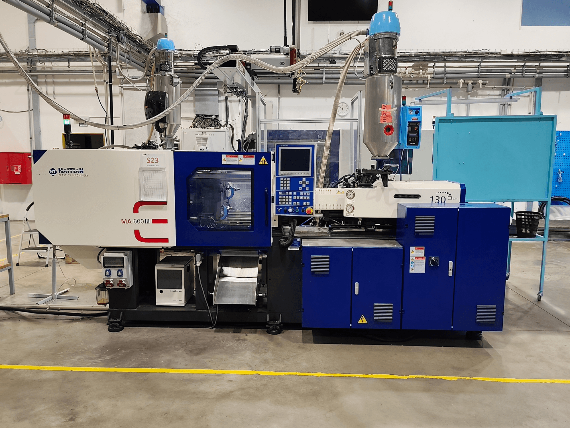 HAITIAN Mars III MA 600/130B eco elektrikli enjeksiyon kalıplama makinesi; kontrol paneli ve enjeksiyon ünitesini gösteren önden görünüm.